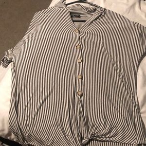 White striped button up shirt that ties at the bottom